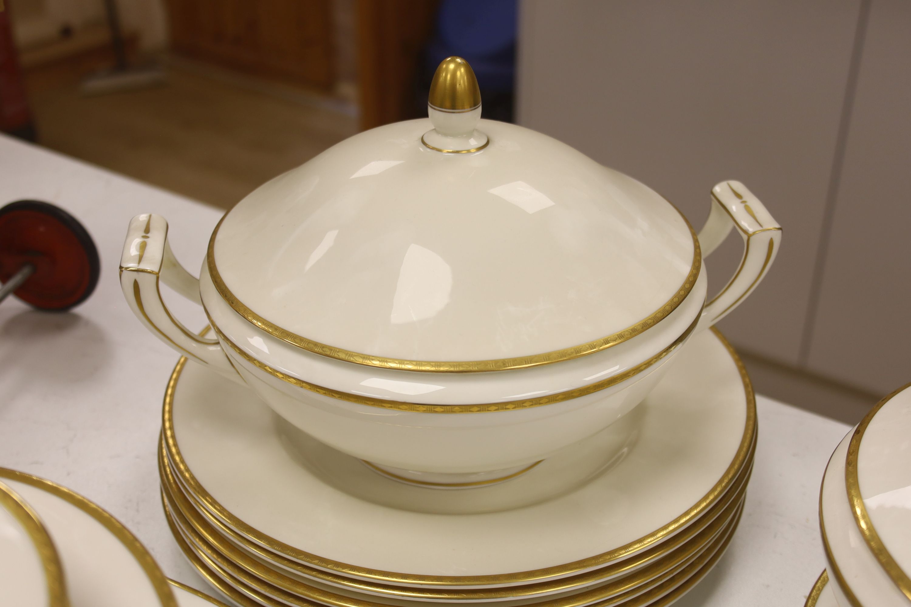 A Minton 'Golden Heritage' gilt bordered dinner service